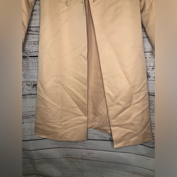 Feather Cuff Tuxedo Coat
Elegant Pink Peach Feather-Trimmed Coat - Picture 7 of 15